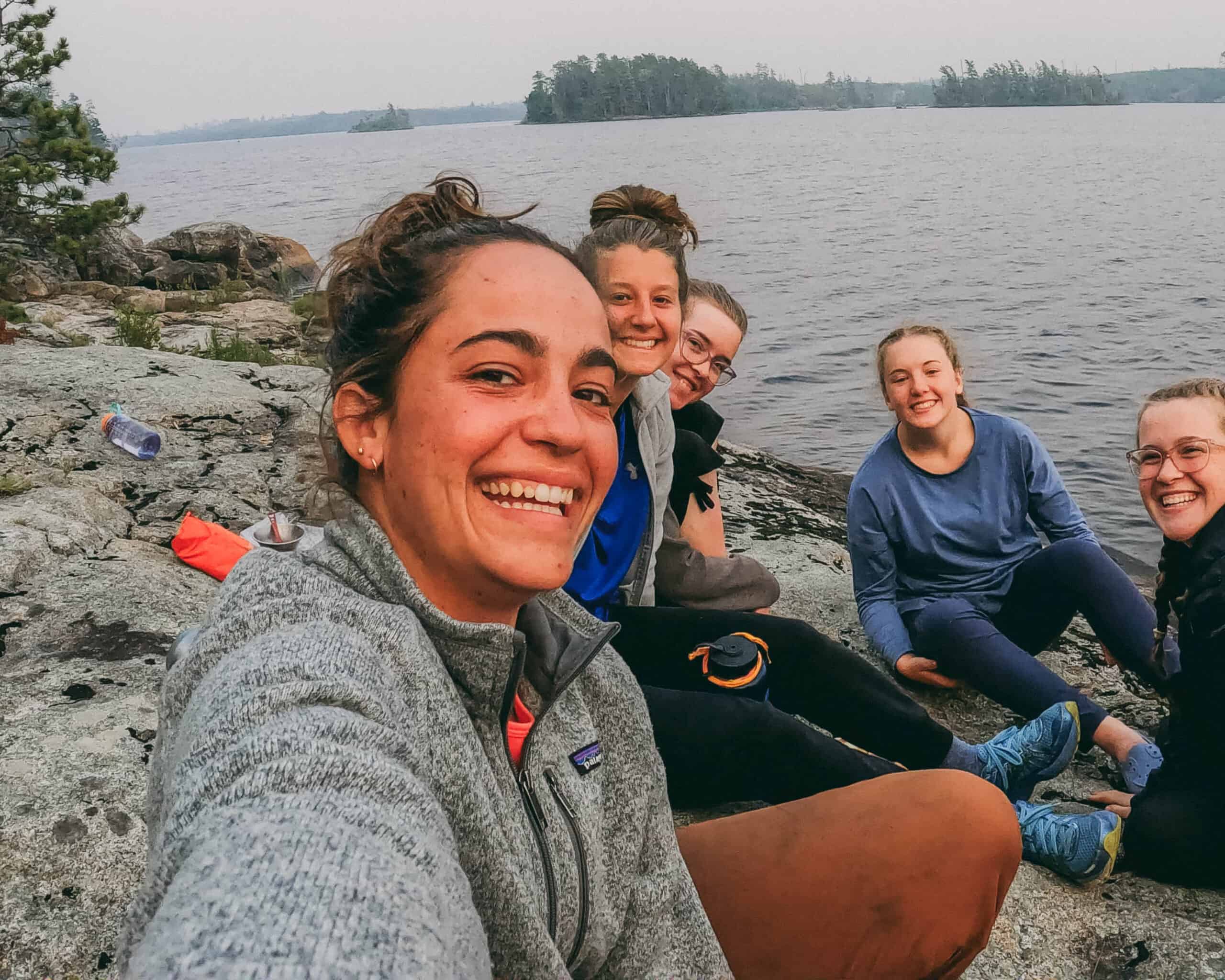 Youth conservation program at Coldwater Foundation 2025, outdoor group sitting by the lake.